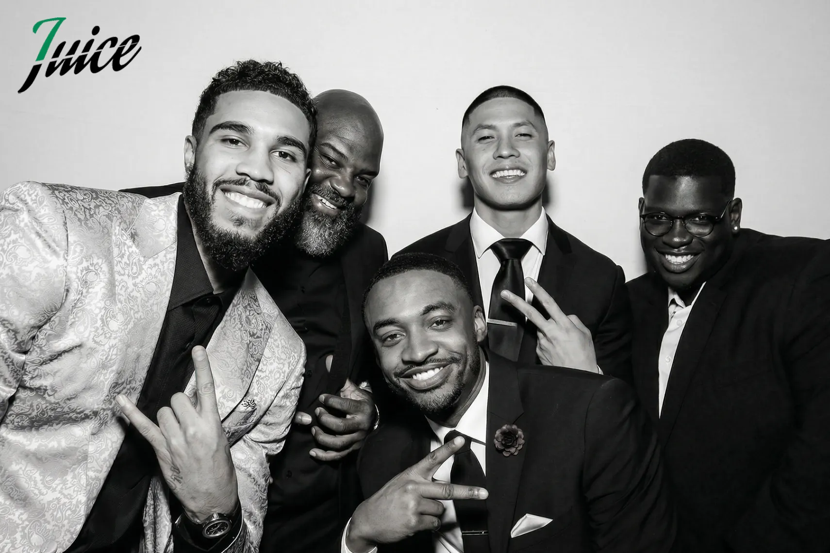 Allure Booth black and white group portrait of five friends in suits at a gala
