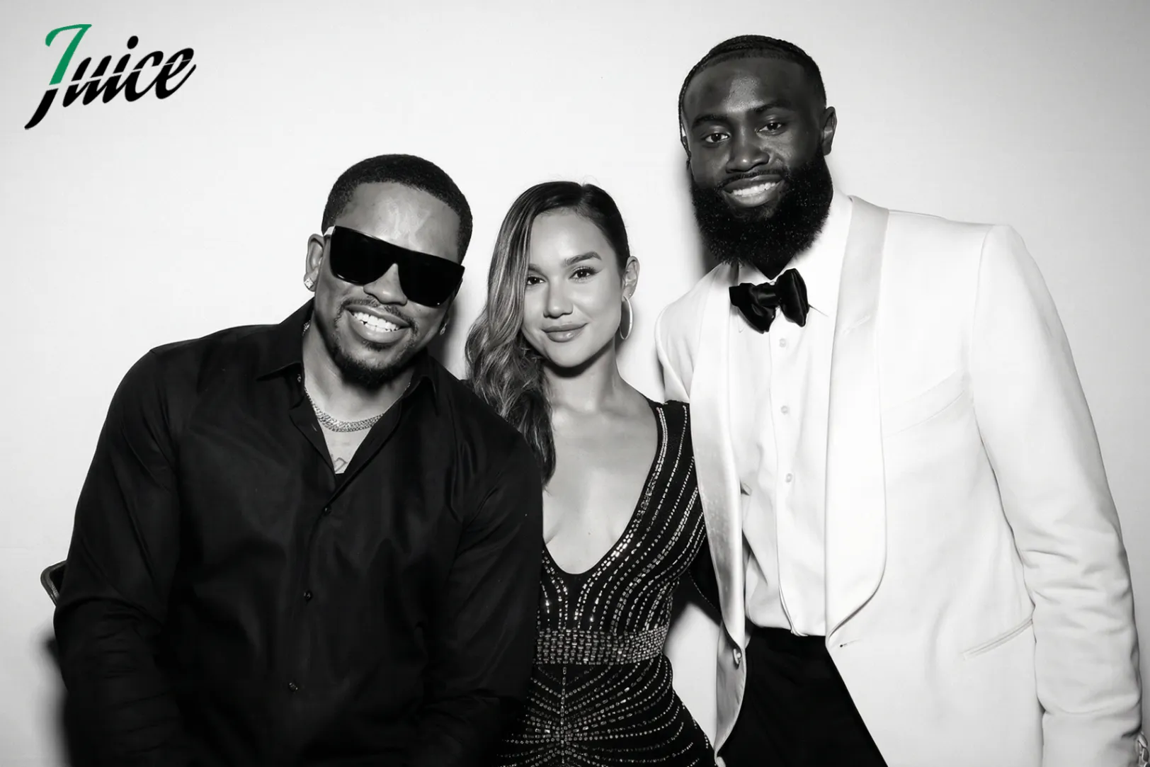 Allure Booth black and white portrait of three guests at a formal Celtics event