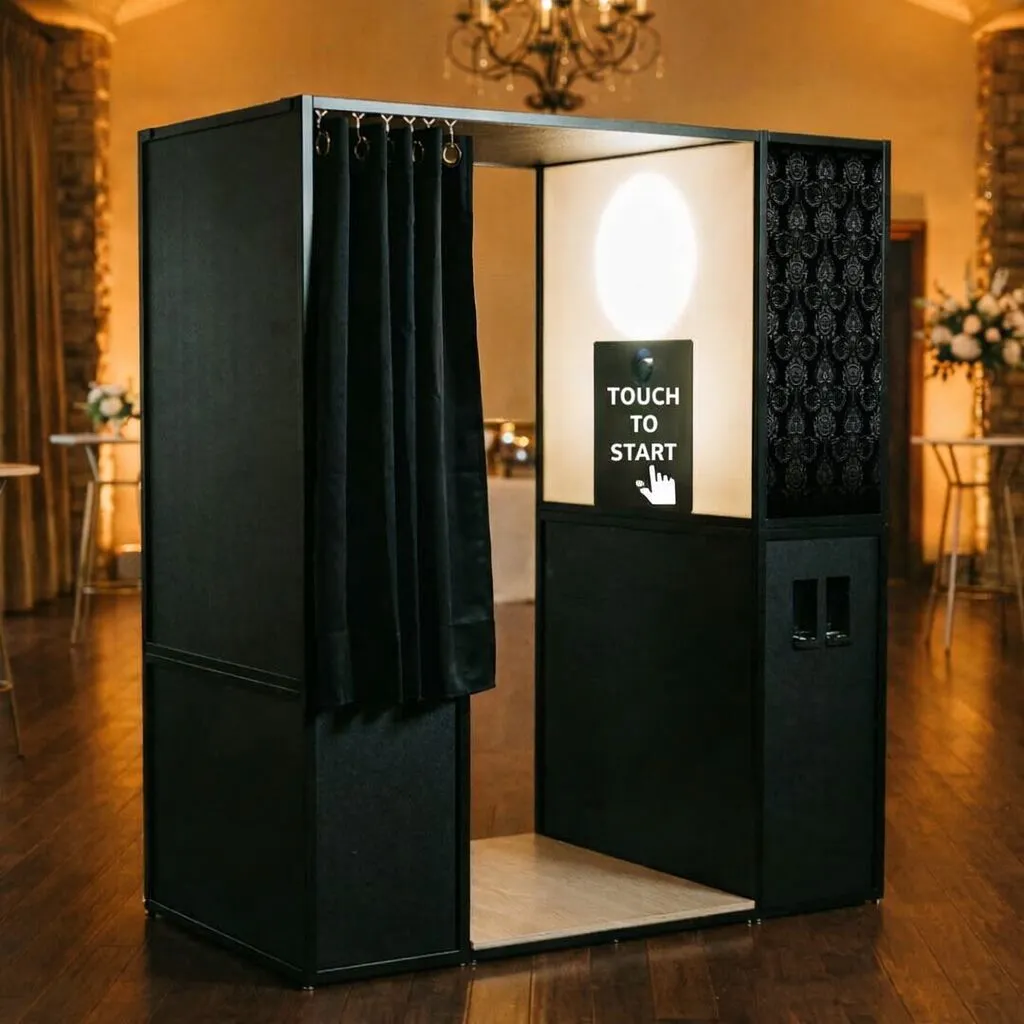 The VIP Booth enclosed photo booth with curtain entrance and luxury black finish at an event venue