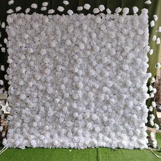 White Luxe flower wall with tightly packed white roses and floating bloom detail