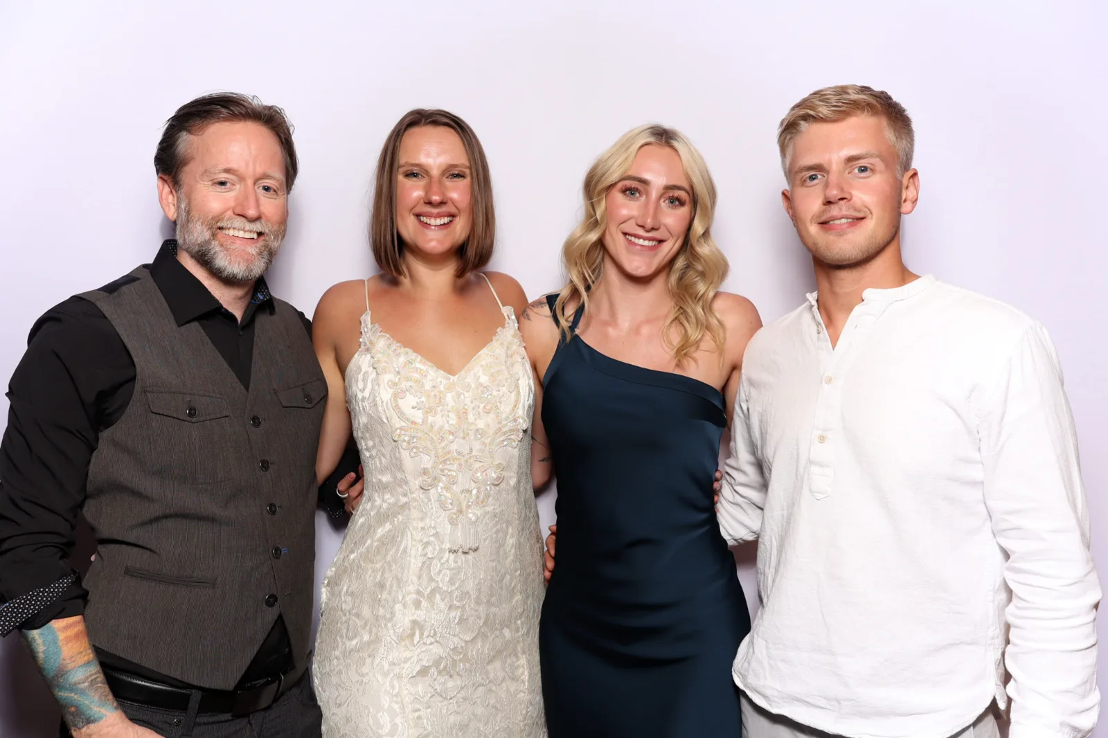 Four wedding guests posing in The Lux Booth