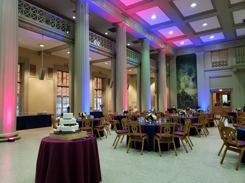 wedding uplighting design illuminating columns in a grand event hall